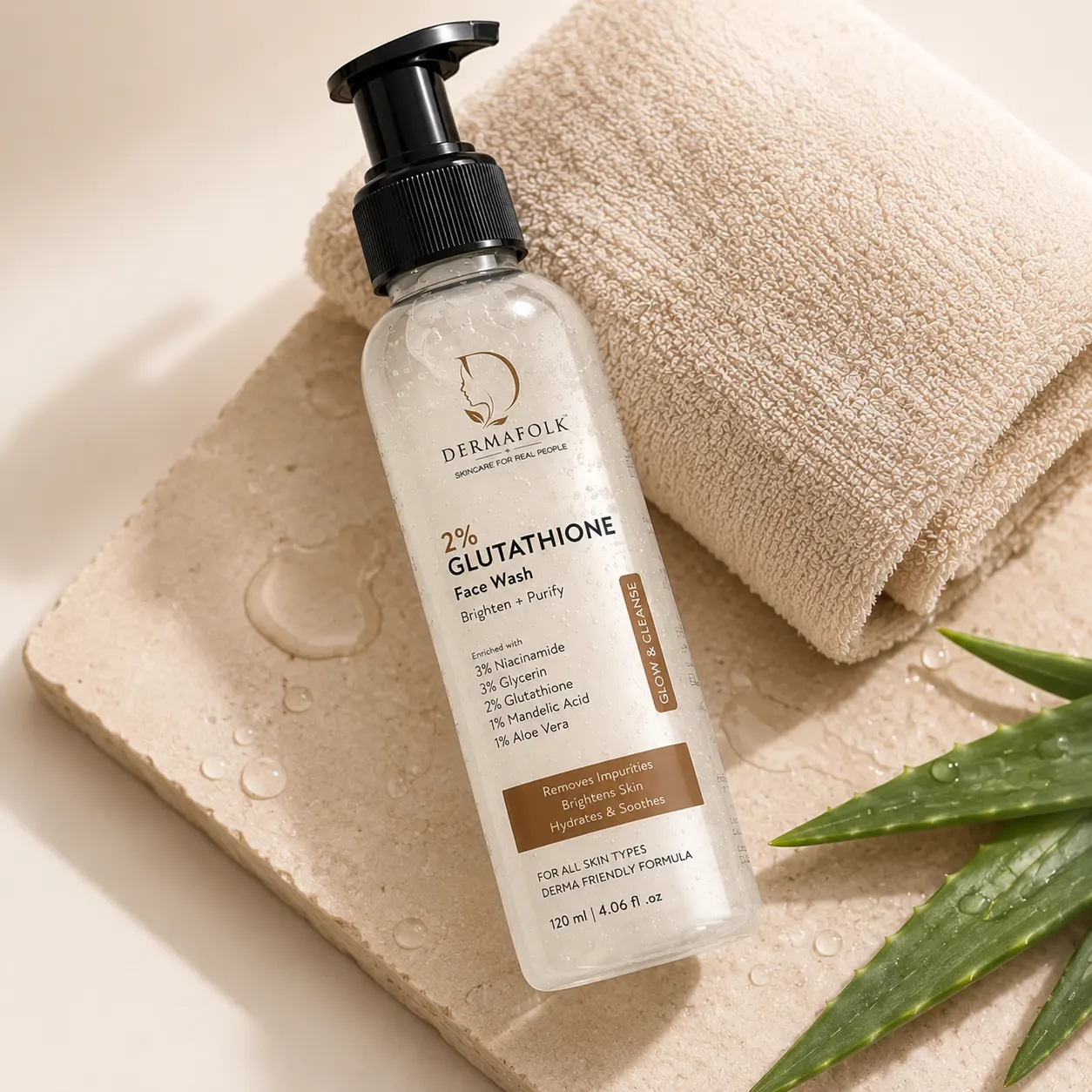 Dermafolk product bottle on a stone tray with a folded towel and aloe vera